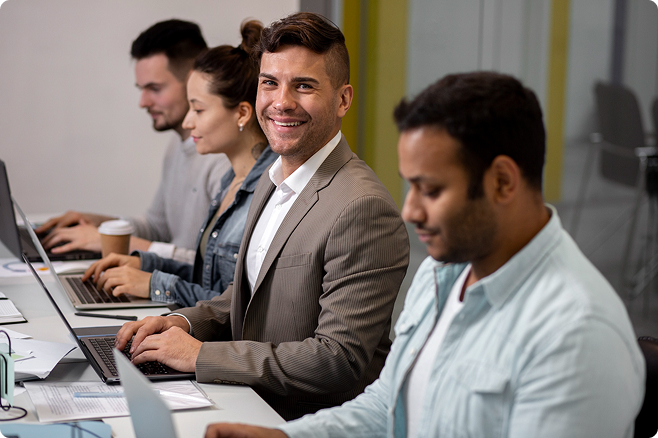 Professionals working on laptops